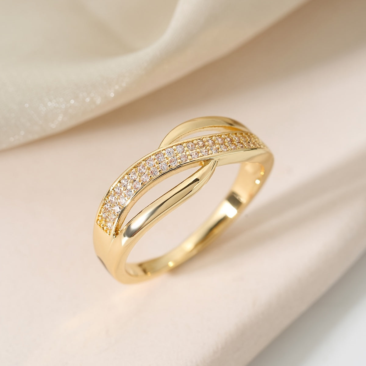 Elegant Gold-Coloured Crossover Ring with Stones